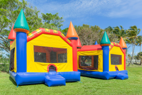 Two,multi Color,castle,bounce,houses,are,ready,for,the,kids.