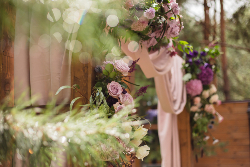 Wedding,arch,with,cloth,and,flowers,with,bokeh.,composition,of